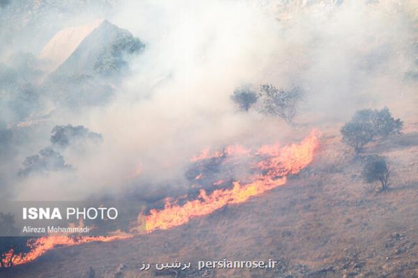 تلاش خوزستان و كهگیلویه برای مهار آتش در كوه های حاتم